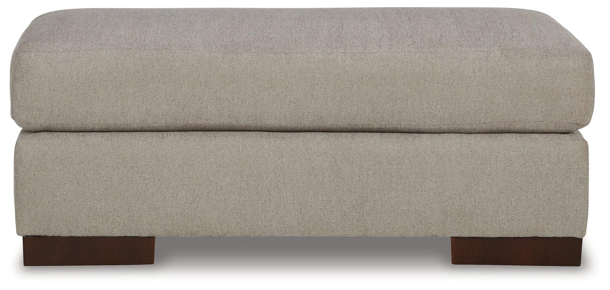 Maggie Flax Ottoman by Ashley at Eve Furniture
