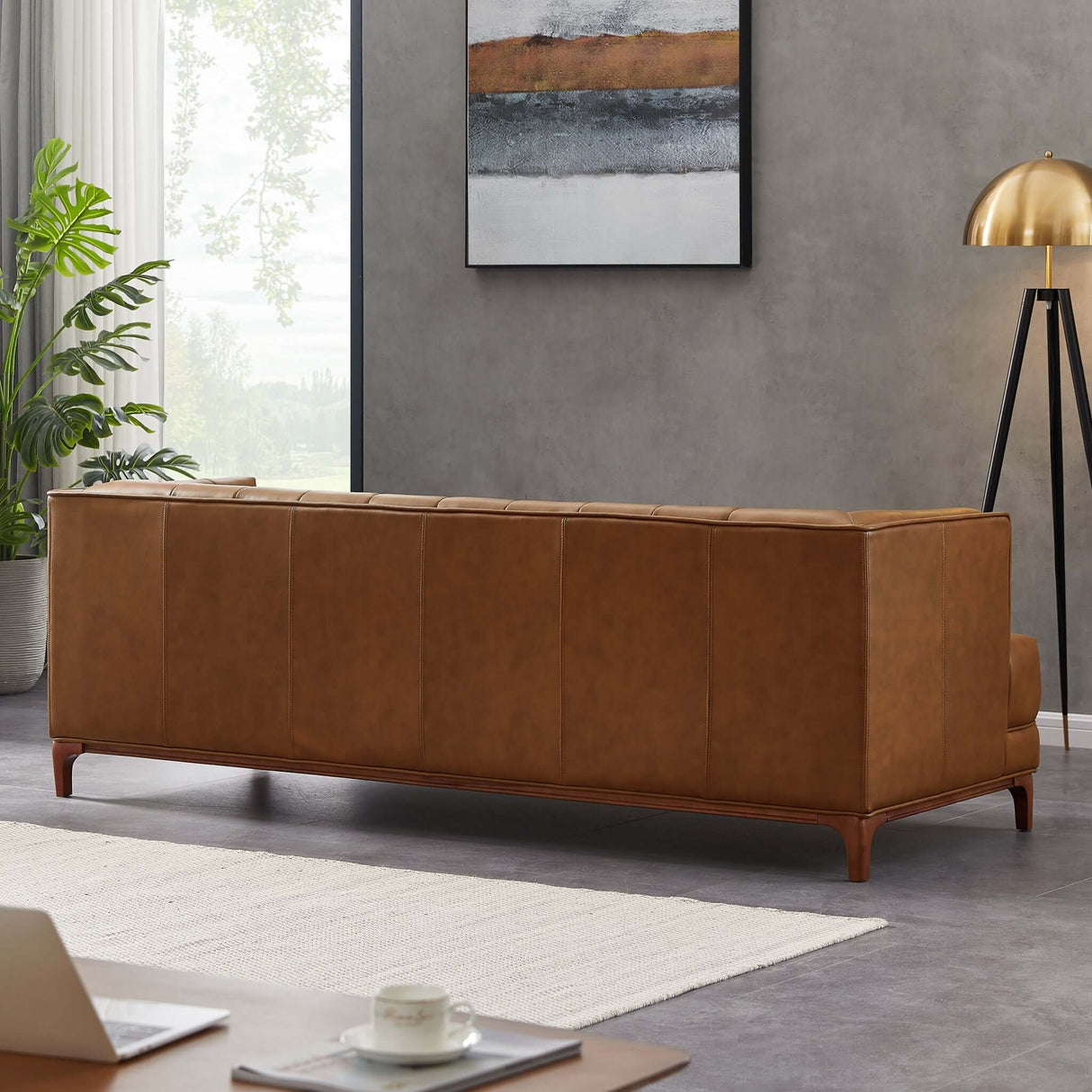 Brown leather tufted sofa