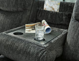 Martinglenn Ebony Reclining Sofa with Drop Down Table