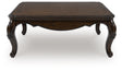 Maylee Dark Brown Coffee Table by Ashley at Eve Furniture