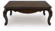 Maylee Dark Brown Coffee Table by Ashley at Eve Furniture