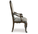 Maylee Dining Table and 10 Chairs with Storage in Dark Brown by Ashley at Eve Furniture