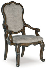 Maylee Dining Table and 10 Chairs with Storage in Dark Brown by Ashley at Eve Furniture