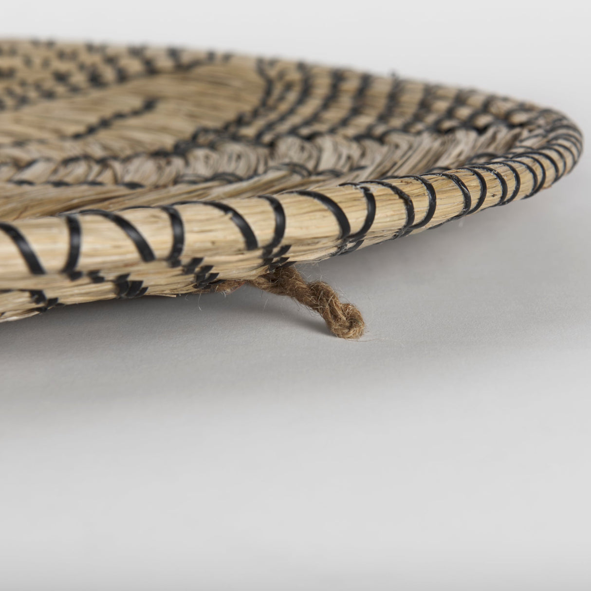 Mekhi Light Brown Seagrass W/Black String Round Wall Hanging Plate by Mercana at Eve Furniture