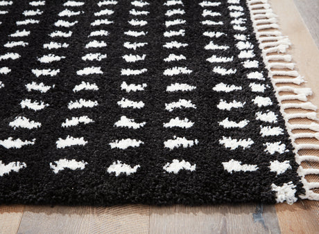 Minston Black/White 5' x 7' Rug by Ashley at Eve Furniture