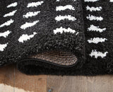 Minston Black/White 5' x 7' Rug by Ashley at Eve Furniture