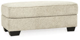 Monaghan Sandstone Ottoman by Ashley at Eve Furniture