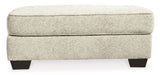 Monaghan Sandstone Ottoman by Ashley at Eve Furniture