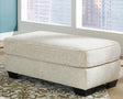 Monaghan Sandstone Ottoman by Ashley at Eve Furniture