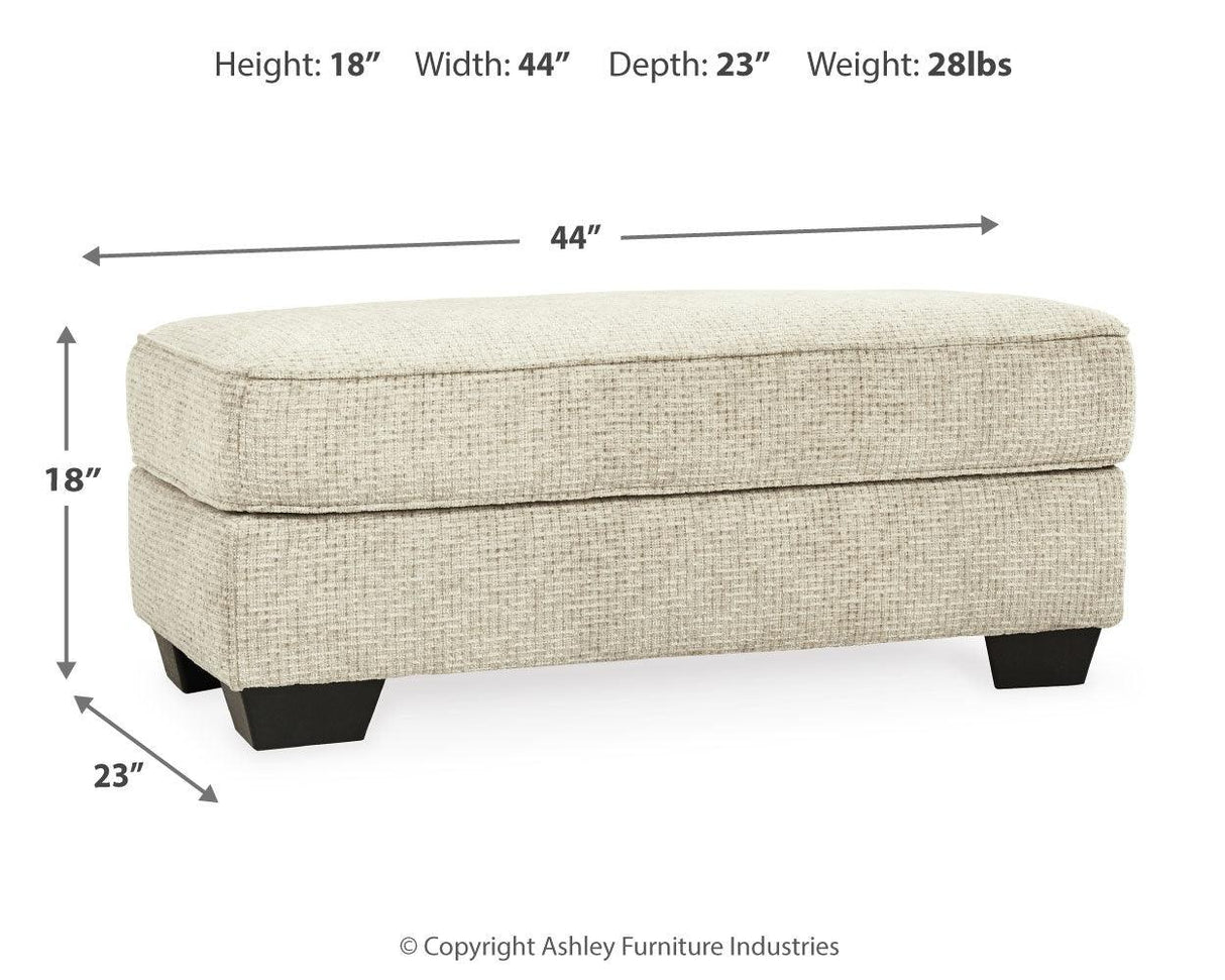 Monaghan Sandstone Ottoman by Ashley at Eve Furniture