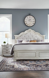Montelaine Antique White King Upholstered Panel Bed by Ashley at Eve Furniture