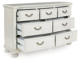 Montelaine Antique White Upholstered Panel Bedroom Set by Ashley at Eve Furniture