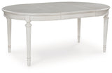 Montelaine Antiqued White Extendable Dining Room Set by Ashley at Eve Furniture