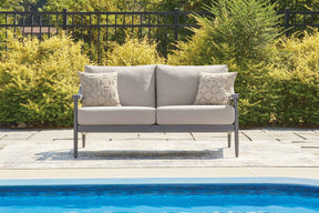 Ocean Beach Gray Outdoor Loveseat with Cushion by Ashley at Eve Furniture