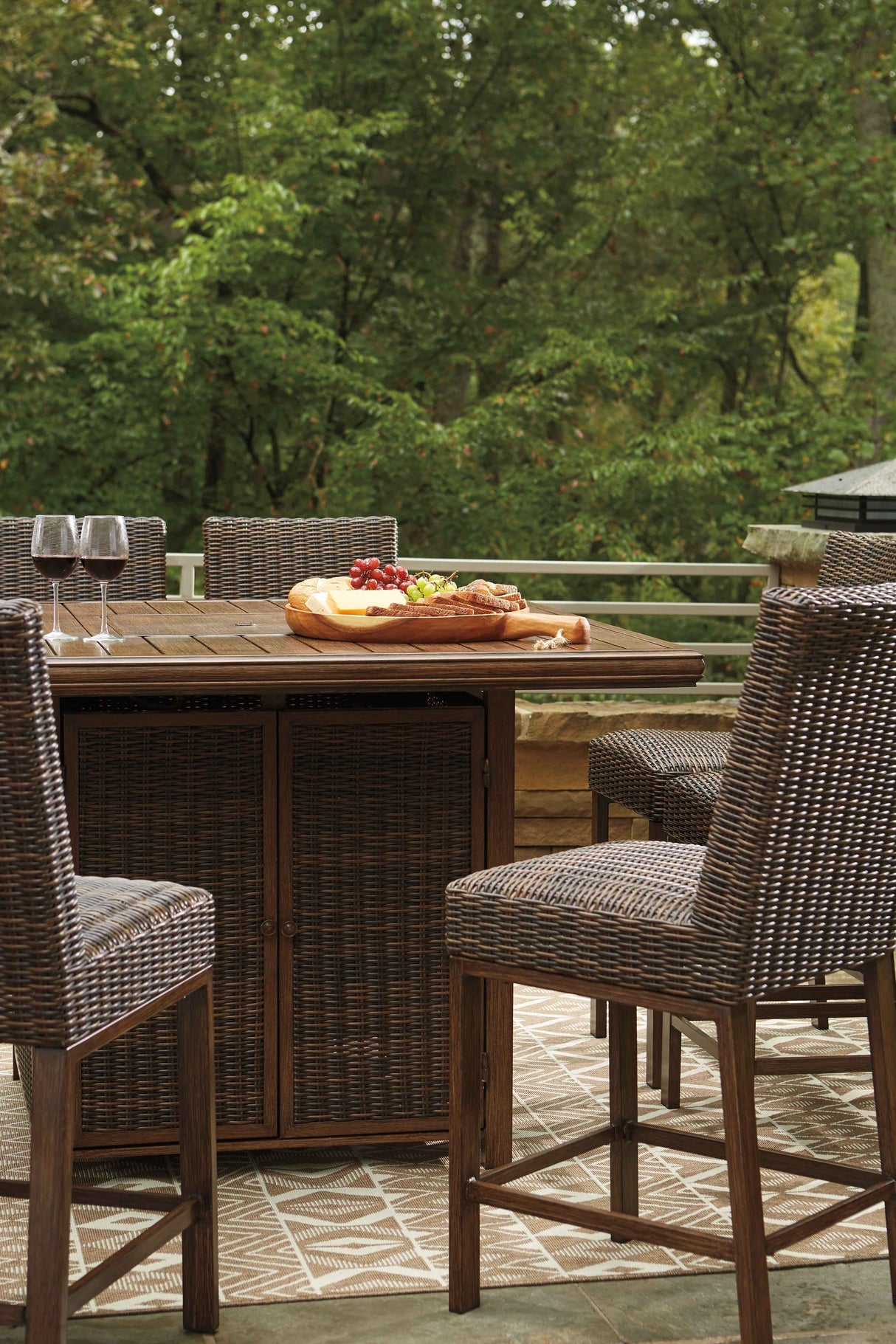 Paradise Trail Medium Brown Outdoor Bar Fire Pit Table with 6 Barstools by Ashley at Eve Furniture
