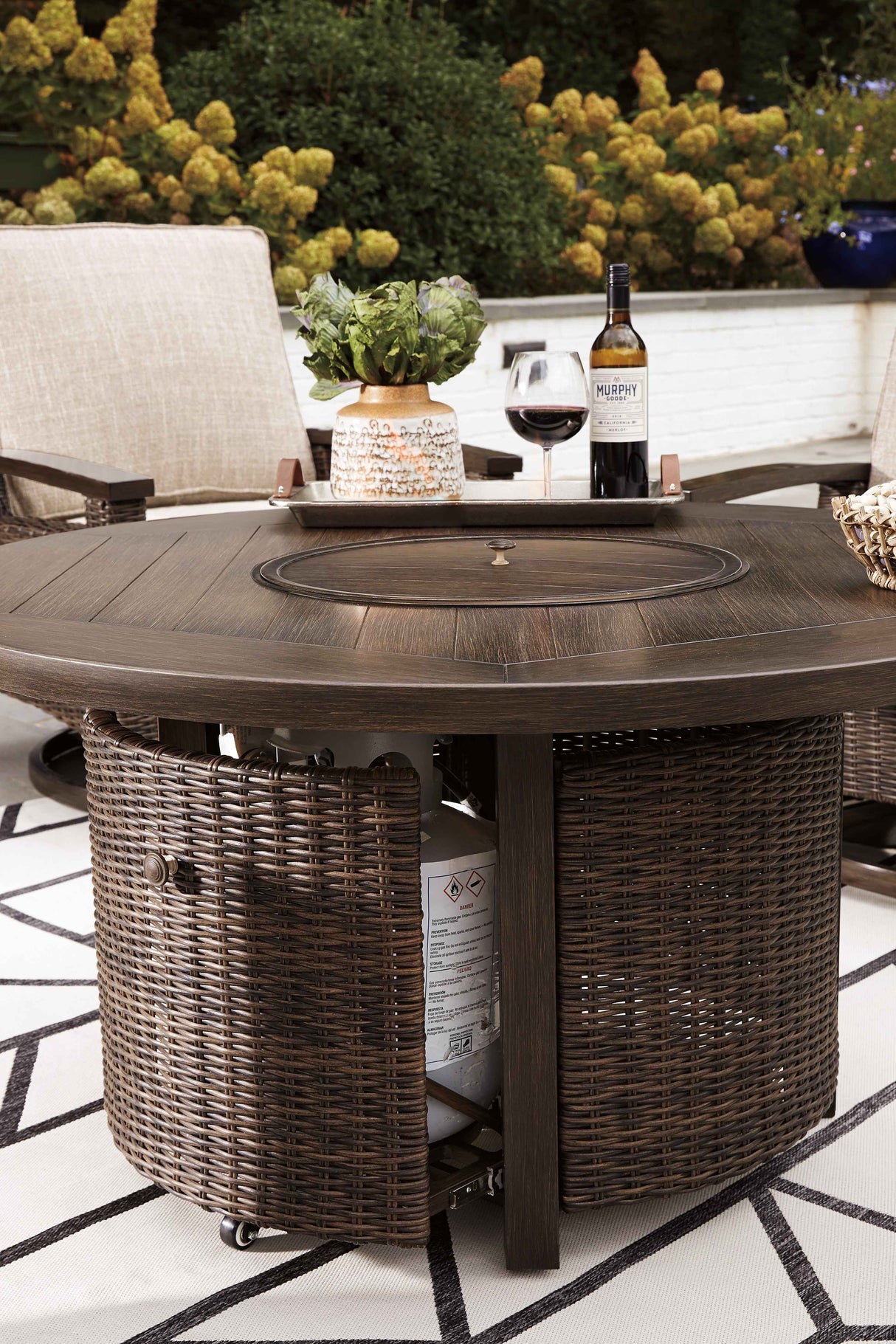 Paradise Trail Medium Brown Outdoor Fire Pit Table with 4 Lounge Chairs by Ashley at Eve Furniture