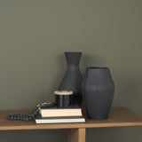 Patine Matte Black Metal Fluted Hourglass Decorative Vase by Mercana at Eve Furniture