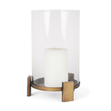 Price Large Antiqued Gold Metal w/ Glass Hurricane Candle Holder by Mercana at Eve Furniture