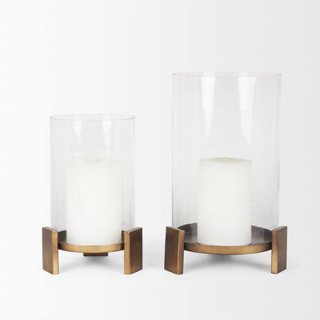 Price Small Antiqued Gold Metal w/ Glass Hurricane Candle Holder by Mercana at Eve Furniture