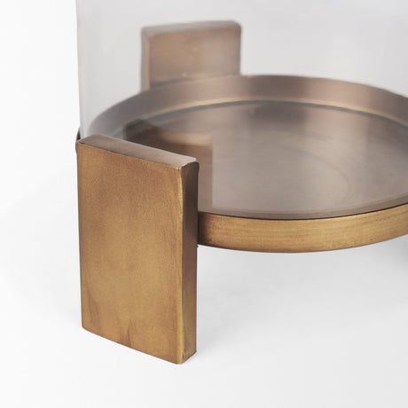 Price Small Antiqued Gold Metal w/ Glass Hurricane Candle Holder by Mercana at Eve Furniture
