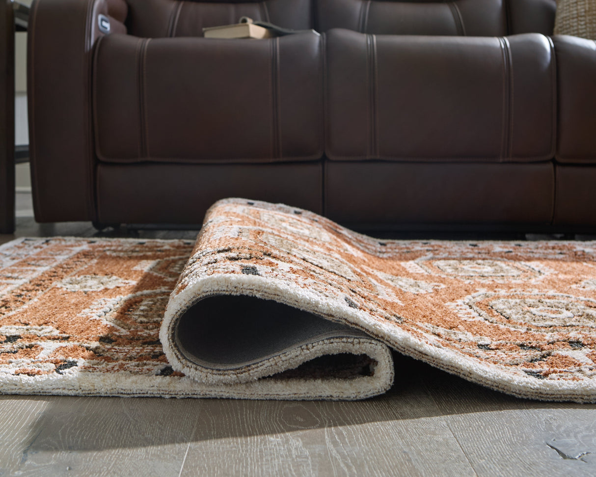 Qaabiz Sienna/Ivory/Black Large Rug by Ashley at Eve Furniture