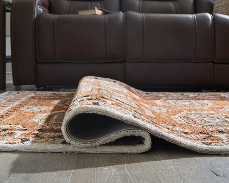 Qaabiz Sienna/Ivory/Black Medium Rug by Ashley at Eve Furniture
