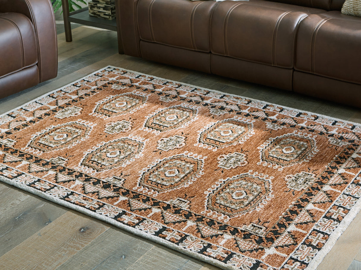 Qaabiz Sienna/Ivory/Black Medium Rug by Ashley at Eve Furniture