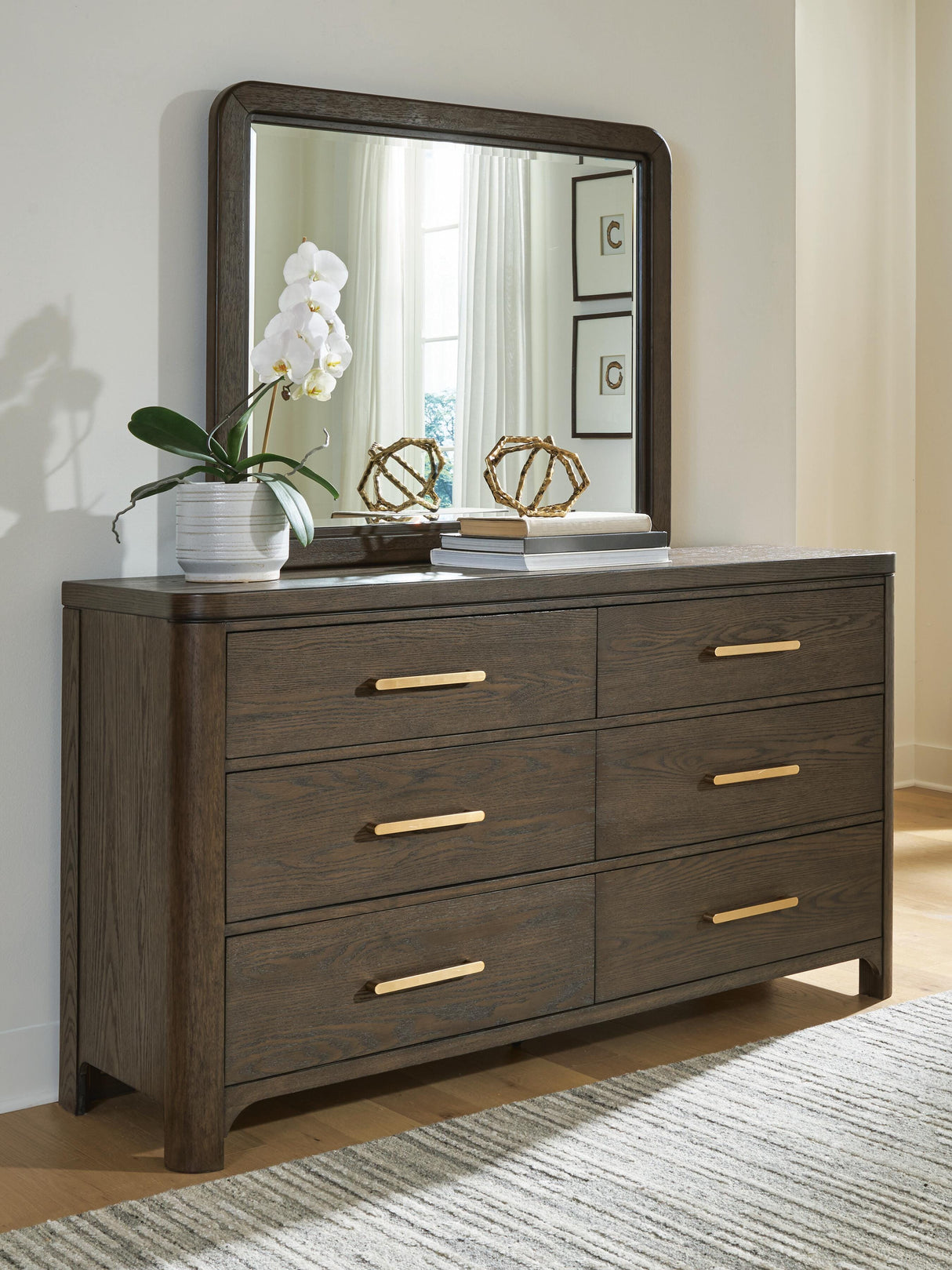 Radkin Burnished Brown Dresser and Mirror by Ashley at Eve Furniture