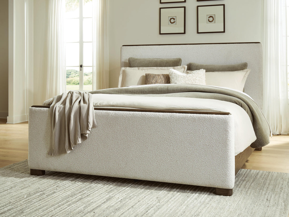 Radkin Burnished Brown King Uphostered Panel Bed by Ashley at Eve Furniture