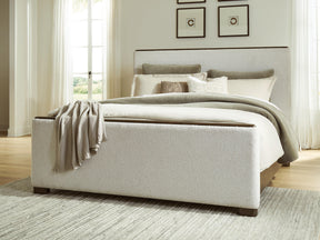 Radkin Burnished Brown Queen Uphostered Panel Bed by Ashley at Eve Furniture