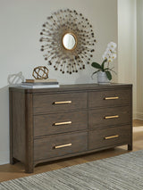 Radkin Burnished Brown Uphostered Panel Bedroom Set by Ashley at Eve Furniture