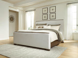 Radkin Burnished Brown Uphostered Panel Bedroom Set by Ashley at Eve Furniture
