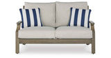 Rainier Ranch Brown/Beige Outdoor Sofa and Loveseat by Ashley at Eve Furniture