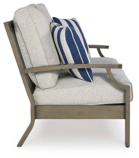 Rainier Ranch Brown/Beige Outdoor Sofa and Loveseat by Ashley at Eve Furniture