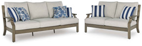 Rainier Ranch Brown/Beige Outdoor Sofa and Loveseat by Ashley at Eve Furniture