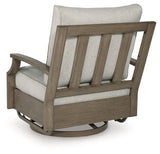 Rainier Ranch Brown/Beige Outdoor Swivel Glider Chair with Cushion by Ashley at Eve Furniture