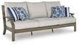 Rainier Ranch Brown/Beige Outdoor Sofa with Cushion by Ashley at Eve Furniture