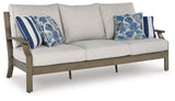 Rainier Ranch Brown/Beige Outdoor Sofa with Cushion by Ashley at Eve Furniture
