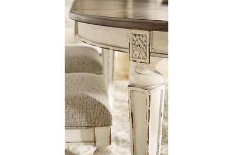 Realyn Chipped White Oval Dining Extension Table by Ashley at Eve Furniture