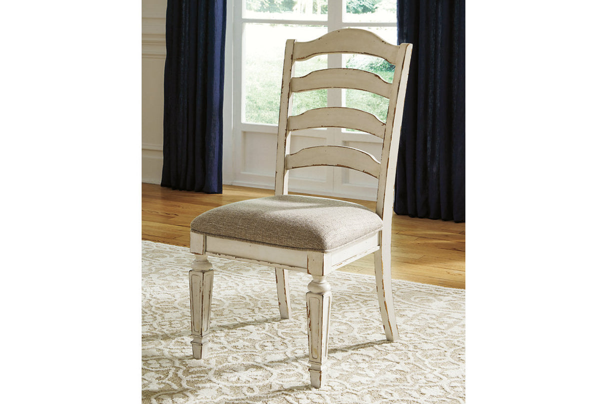 Realyn Chipped White Oval Dining Table and 4 Ladder Back Chairs by Ashley at Eve Furniture