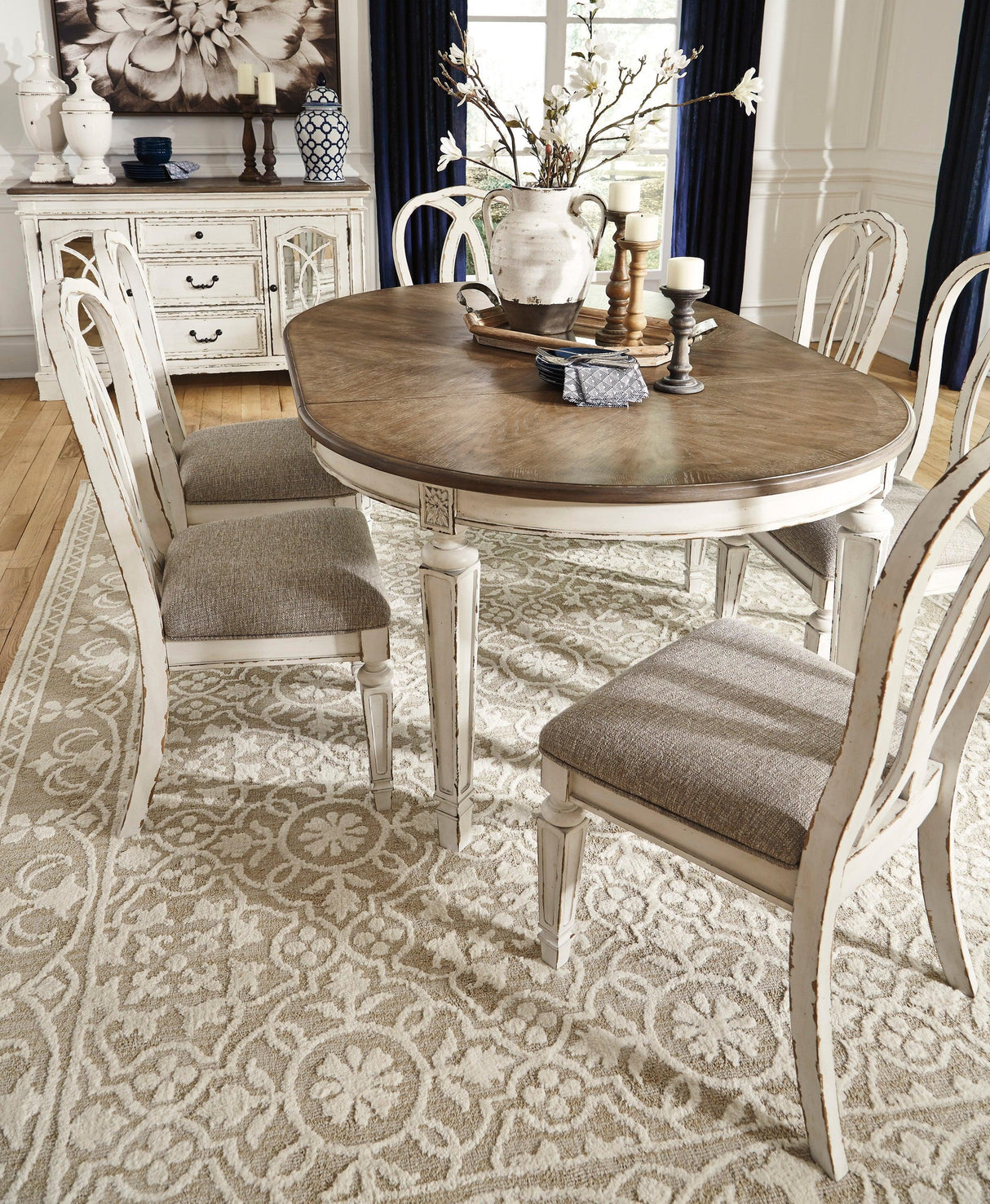 Realyn Chipped White Oval Extendable Round/Oval Ribbon Dining Set by Ashley at Eve Furniture
