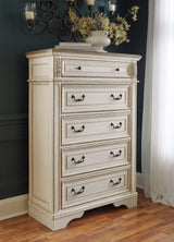 Realyn Chipped White Upholstered Sleigh Bedroom Set by Ashley at Eve Furniture
