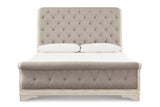Realyn Chipped White Upholstered Sleigh Bedroom Set by Ashley at Eve Furniture