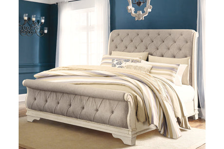 Realyn Chipped White Upholstered Sleigh Bedroom Set by Ashley at Eve Furniture