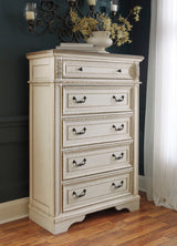 Realyn Chipped White Upholstered Storage Platform Bedroom Set with Footboard Bench by Ashley at Eve Furniture