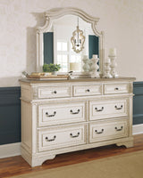 Realyn Chipped White Upholstered Storage Platform Bedroom Set with Footboard Bench by Ashley at Eve Furniture