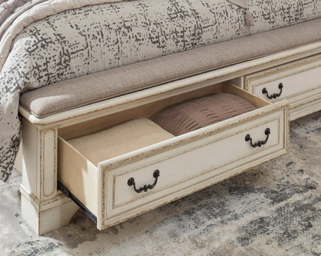 Realyn Chipped White Upholstered Storage Platform Bedroom Set with Footboard Bench by Ashley at Eve Furniture