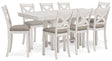Robbinsdale Antique White Counter Height Dining Table and 8 Barstools by Ashley at Eve Furniture