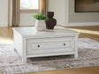 Robbinsdale Antique White Lift-Top Coffee Table by Ashley at Eve Furniture