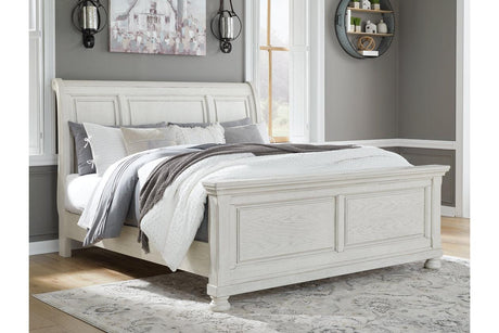 Robbinsdale Antique White Queen Sleigh Bed by Ashley at Eve Furniture